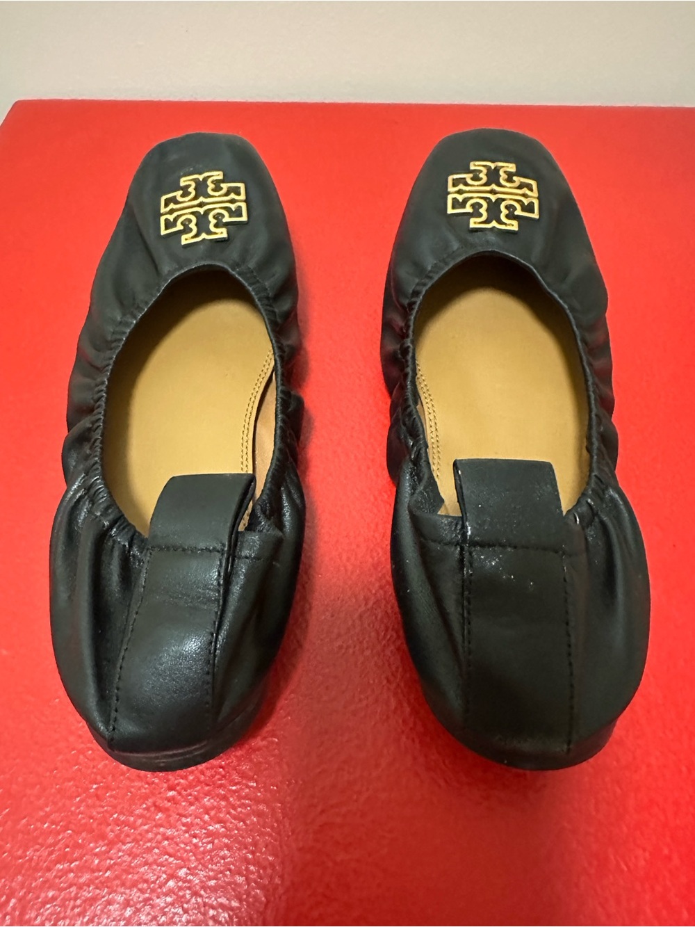 Tory Burch Black Leather Logo Ballet Flats with Gold Emblem